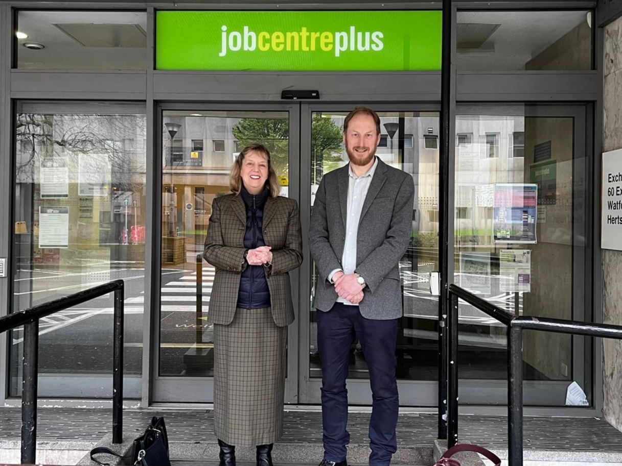 Photograph of Social Security Advisory Committee members Dr Suzy Walton and Carl Emmerson outside of a Jobcentre building.
